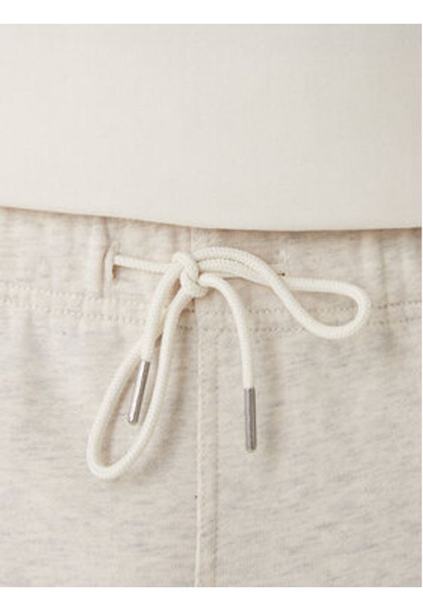 Calvin Klein Jeans Spodnie dresowe Embossed Monologo LV047F206G Beżowy Wide Leg. Kolor: beżowy. Materiał: bawełna