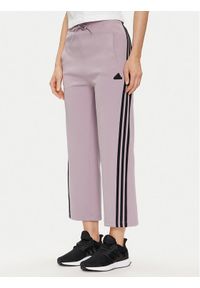 Adidas - adidas Spodnie dresowe Future Icons 3-Stripes IS3661 Fioletowy Slim Fit. Kolor: fioletowy. Materiał: bawełna