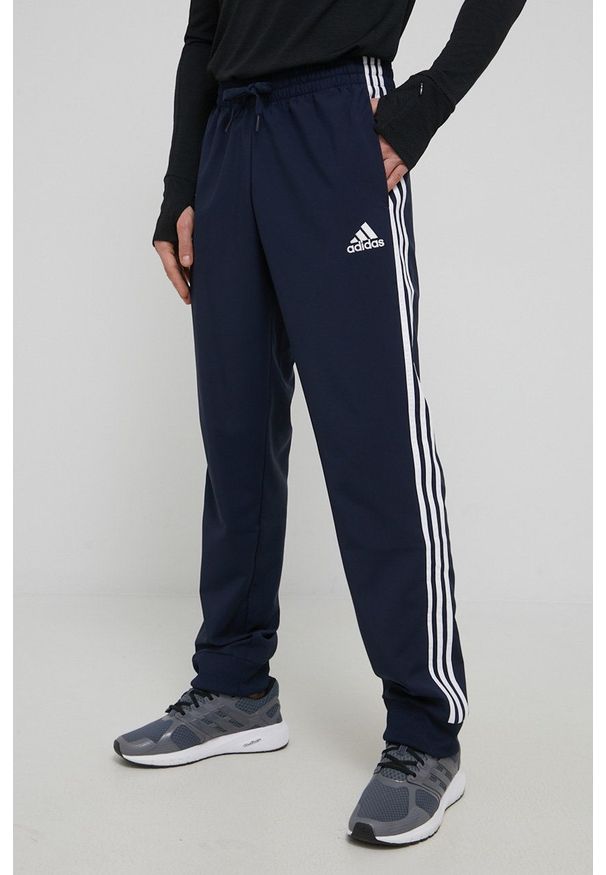 Adidas - adidas spodnie GK8981 męskie kolor granatowy. Kolor: niebieski. Materiał: materiał. Wzór: aplikacja