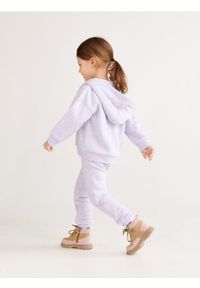 Reserved - Dresowe spodnie jogger - lawendowy. Kolor: fioletowy. Materiał: dresówka. Wzór: melanż #1