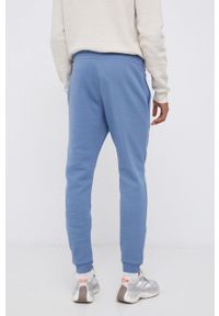 Reebok - Spodnie. Kolor: niebieski. Materiał: włókno. Wzór: nadruk #3