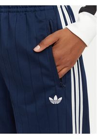 Adidas - adidas Spodnie dresowe Pinstripe Firebird Loose Trackpant KS9976 Granatowy Loose Fit. Kolor: niebieski. Materiał: syntetyk #2
