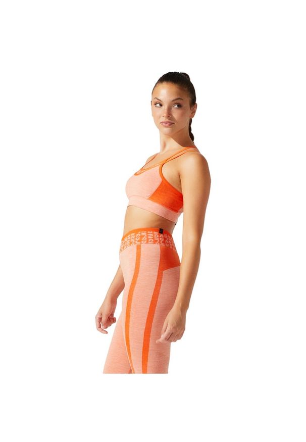Biustonosz sportowy damski Asics Cropped Logo Seamless Bra. Kolor: pomarańczowy. Materiał: nylon, elastan, poliester. Sport: fitness