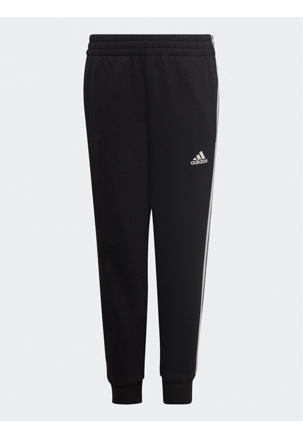 Adidas - adidas Spodnie dresowe adidas Essential 3-Stripes Joggers H65796 Czarny Regular Fit. Kolor: czarny. Materiał: bawełna