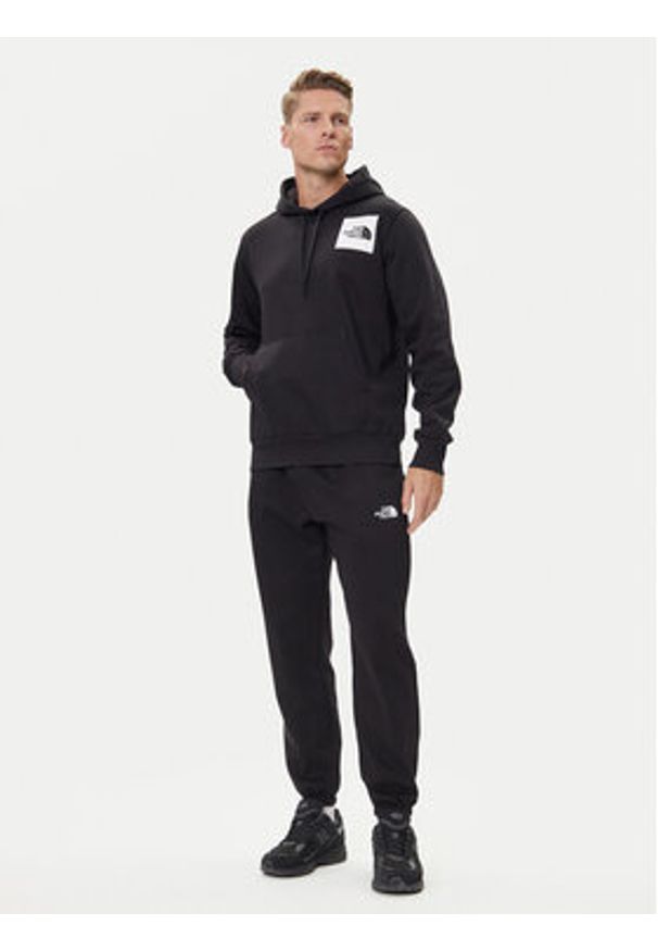 The North Face Spodnie dresowe Simple Dome NF0A8C1W Czarny Regular Fit. Kolor: czarny. Materiał: bawełna, syntetyk