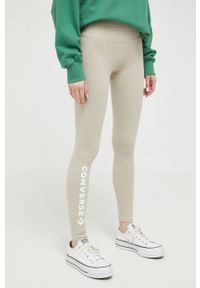 Converse legginsy damskie kolor beżowy z nadrukiem. Stan: podwyższony. Kolor: beżowy. Materiał: dzianina. Wzór: nadruk #1