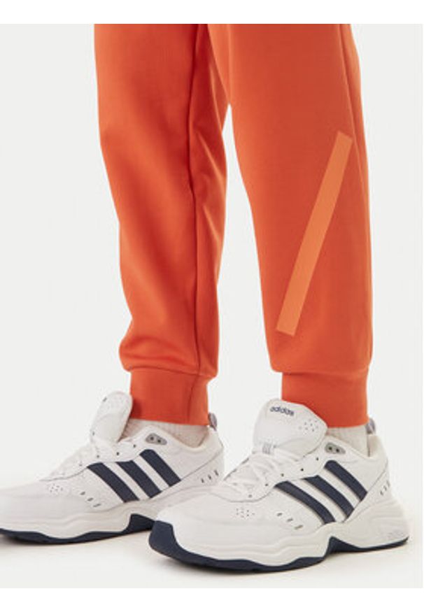 Adidas - adidas Spodnie dresowe Z.N.E. KE4686 Pomarańczowy Regular Fit. Kolor: pomarańczowy. Materiał: bawełna