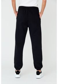 Juicy Couture - JUICY COUTURE Czarne spodnie Heart Diamante. Kolor: czarny. Materiał: bawełna. Wzór: aplikacja