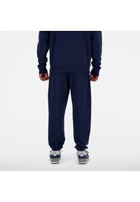 Spodnie męskie New Balance MP41519NNY – granatowe. Kolor: niebieski. Materiał: bawełna, dresówka, poliester. Wzór: haft #3