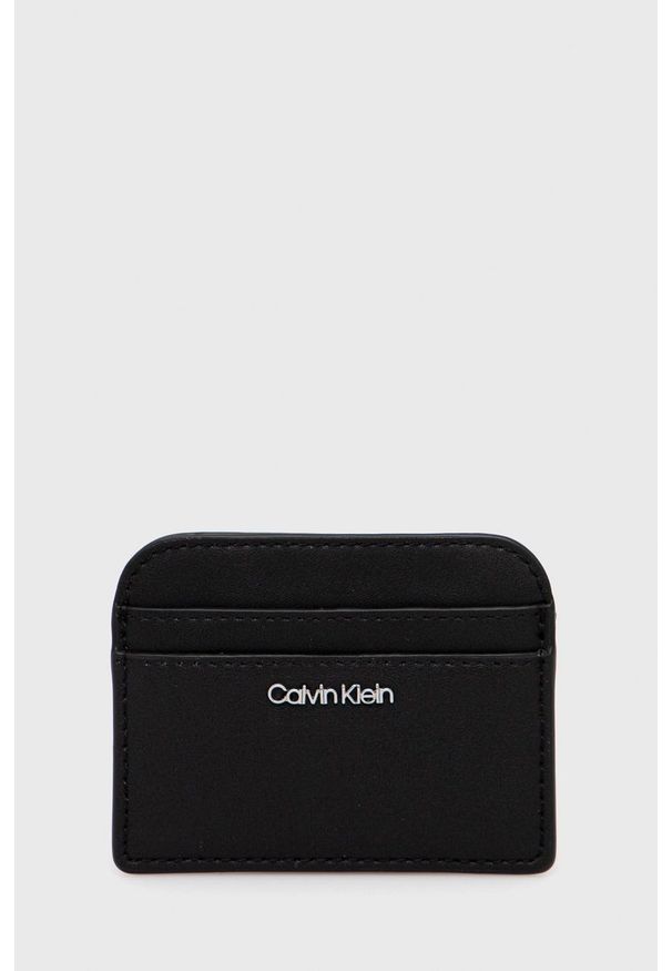 Calvin Klein etui na karty damski kolor czarny. Kolor: czarny. Materiał: materiał. Wzór: gładki