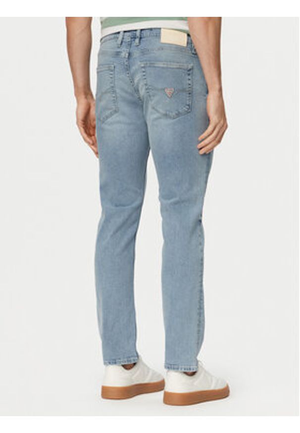 Guess Jeansy M6GAS2 D1118 Niebieski jasny Slim Tapered Fit. Kolor: niebieski