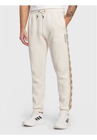 Guess Spodnie dresowe Mickey Z2YB09 KB3P2 Écru Regular Fit. Materiał: syntetyk, bawełna