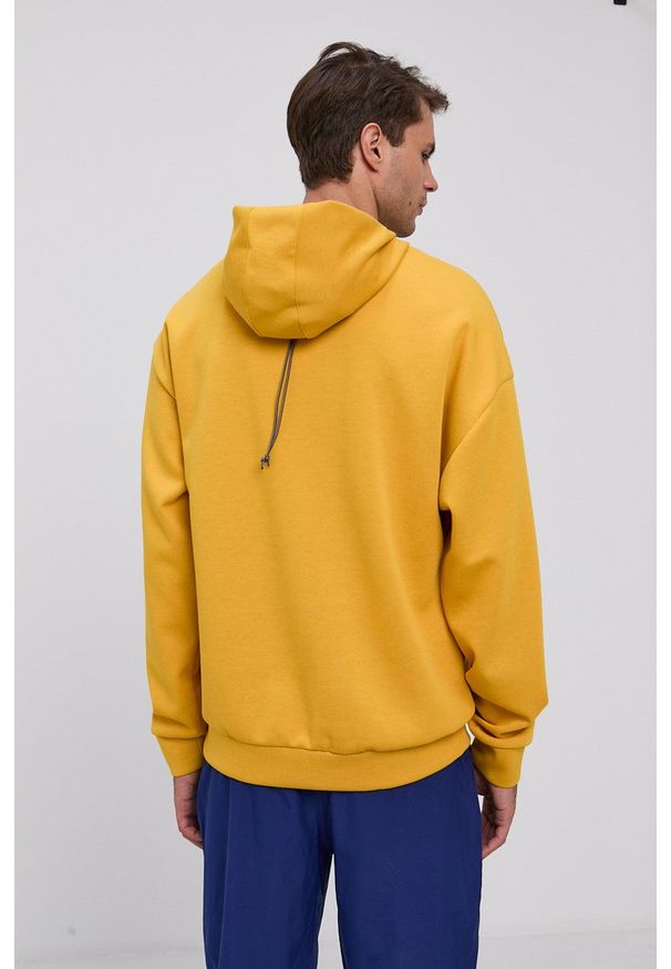 Reebok Bluza męska kolor żółty z kapturem z nadrukiem. Okazja: na co dzień. Typ kołnierza: kaptur. Kolor: żółty. Wzór: nadruk. Styl: casual