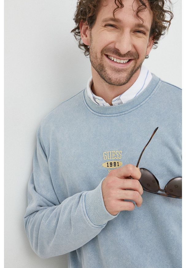 Guess bluza męska kolor niebieski melanżowa. Kolor: niebieski. Wzór: melanż