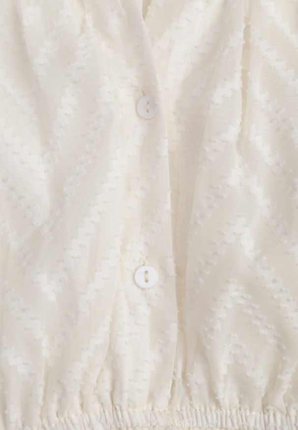 Born2be - Jasnobeżowa Rozkloszowana Sukienka Mini z Bufiastymi Rękawami i Falbanką Illathi. Kolor: beżowy. Materiał: materiał. Wzór: aplikacja. Długość: mini