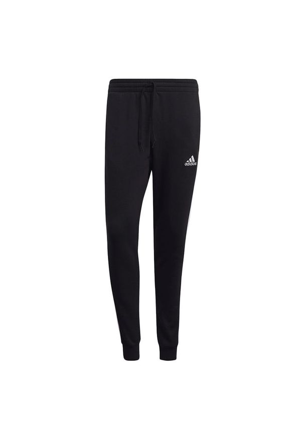 Adidas - Spodnie dresowe adidas Essentials 3-Stripes Fleece GM1089 - czarne. Okazja: na co dzień. Kolor: czarny. Materiał: wiskoza, dresówka, poliester, bawełna. Styl: casual, klasyczny