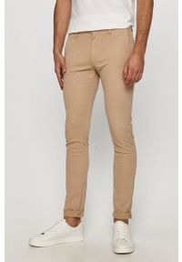 Guess - Spodnie. Kolor: beżowy. Materiał: tkanina. Wzór: gładki #1