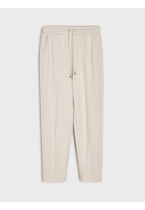 Sinsay - Spodnie cygaretki z dzianiny scuba - kremowy. Kolor: kremowy. Materiał: dzianina