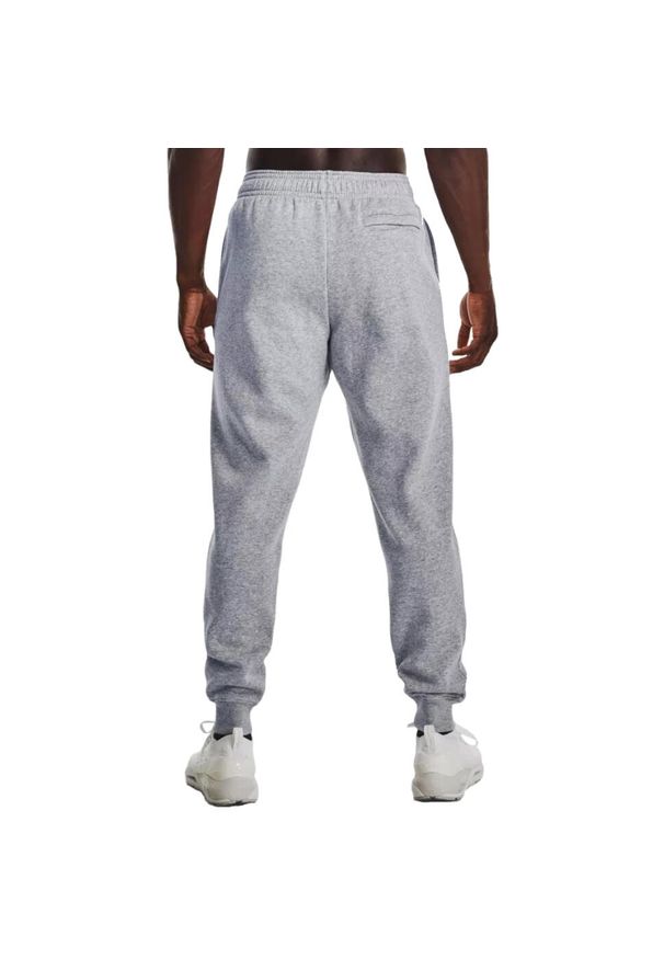 Spodnie sportowe męskie Under Armour Rival. Kolor: szary. Materiał: dresówka. Styl: sportowy. Sport: piłka nożna