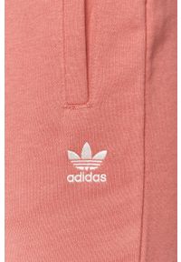 adidas Originals - Spodnie. Kolor: różowy. Materiał: bawełna, materiał, dzianina, elastan, poliester. Wzór: gładki #2