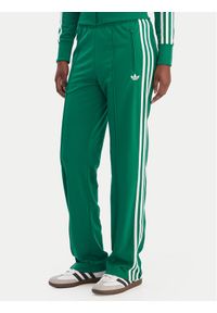 Adidas - adidas Spodnie dresowe Firebird Classic KD3649 Zielony Regular Fit. Kolor: zielony. Materiał: syntetyk #1