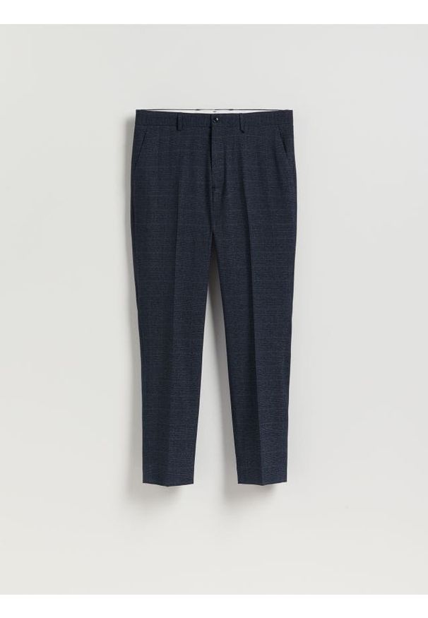 Reserved - Spodnie garniturowe slim fit - granatowy. Kolor: niebieski. Materiał: tkanina