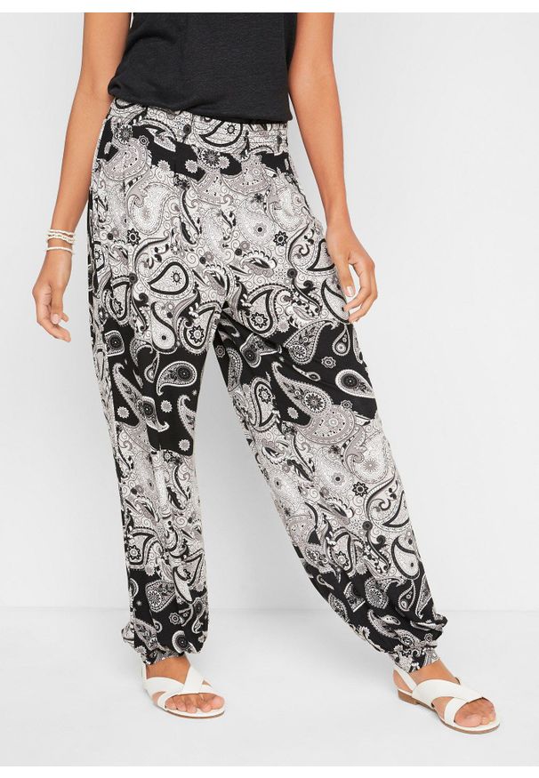bonprix - Dżersejowe spodnie haremki z lejącej mieszanki wiskozy. Kolor: czarny. Materiał: jersey, wiskoza. Wzór: nadruk, paisley