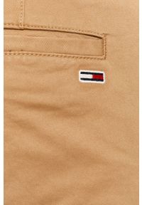 Tommy Jeans - Spodnie. Kolor: beżowy