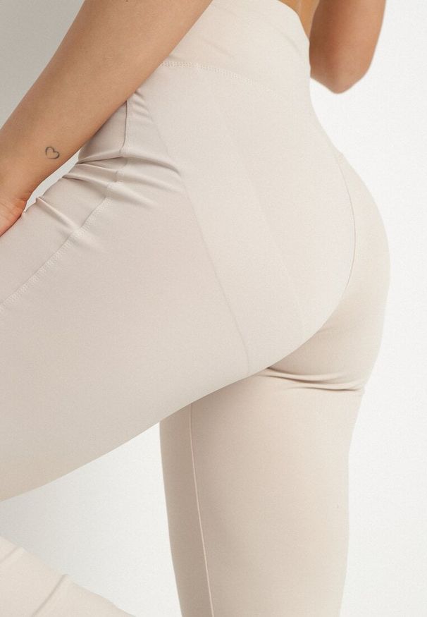Born2be - Beżowe Spodnie Legginsy Typu Dzwony z Wysokim Stanem Melonell. Stan: podwyższony. Kolor: beżowy