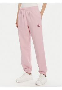 Calvin Klein Jeans Spodnie dresowe Moologo LV047B235G Różowy Regular Fit. Kolor: różowy. Materiał: bawełna #1