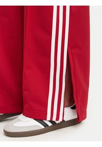 Adidas - adidas Spodnie dresowe Firebird Loose Tracksuit KS4670 Czerwony Loose Fit. Kolor: czerwony. Materiał: syntetyk #3