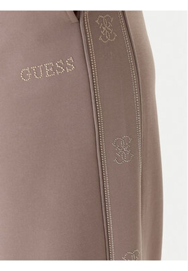 Guess Spodnie dresowe V5BB12 KCX22 Beżowy Wide Leg. Kolor: beżowy. Materiał: syntetyk