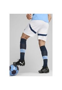Puma - Szorty Manchester City 2024/25. Kolor: biały, wielokolorowy, niebieski. Sport: piłka nożna