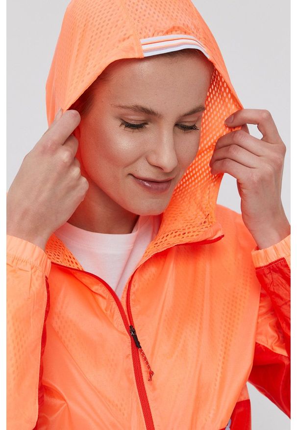 New Balance Kurtka damska kolor pomarańczowy przejściowa. Kolor: pomarańczowy