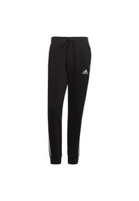 Adidas - Essentials Fleece Tapered Cuff 3-Stripes Pants. Kolor: biały, czarny, wielokolorowy. Materiał: polar. Sport: fitness