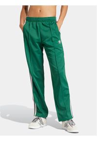 Adidas - adidas Spodnie dresowe adicolor Classics SST IM9818 Zielony Loose Fit. Kolor: zielony. Materiał: bawełna #1