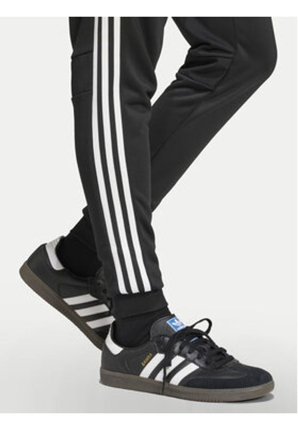 Adidas - adidas Spodnie dresowe Tiro 25 Essentials Sweat JC5464 Czarny Regular Fit. Kolor: czarny. Materiał: syntetyk