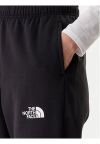 The North Face Spodnie dresowe Simple Dome NF0A8C1Y Czarny Regular Fit. Kolor: czarny. Materiał: syntetyk, bawełna #7