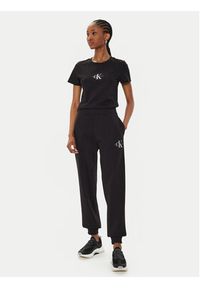 Calvin Klein Jeans Spodnie dresowe Monologo J20J223590 Czarny Relaxed Fit. Kolor: czarny. Materiał: syntetyk, bawełna