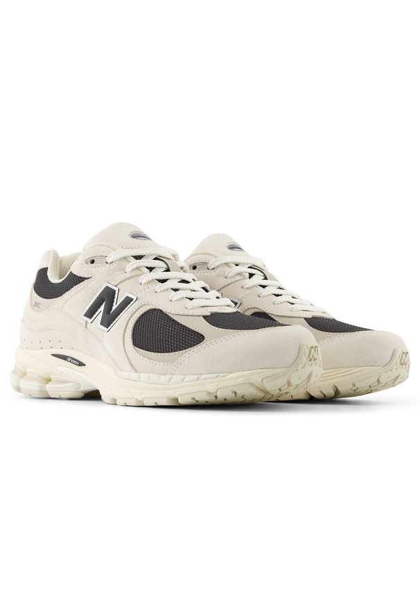 Buty unisex New Balance U2002RN – beżowe. Kolor: beżowy. Materiał: zamsz, guma. Szerokość cholewki: normalna