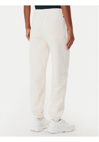 Lacoste Spodnie dresowe XF0353 Beżowy Regular Fit. Kolor: beżowy. Materiał: bawełna #2