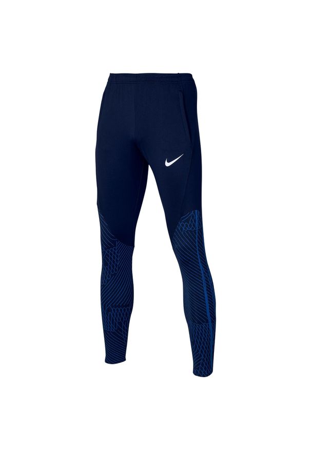 Nike - Spodnie sportowe chłopięce Dri-FIT Strike 23 Jr Pant. Kolor: niebieski. Materiał: poliester, elastan. Technologia: Dri-Fit (Nike). Sport: piłka nożna