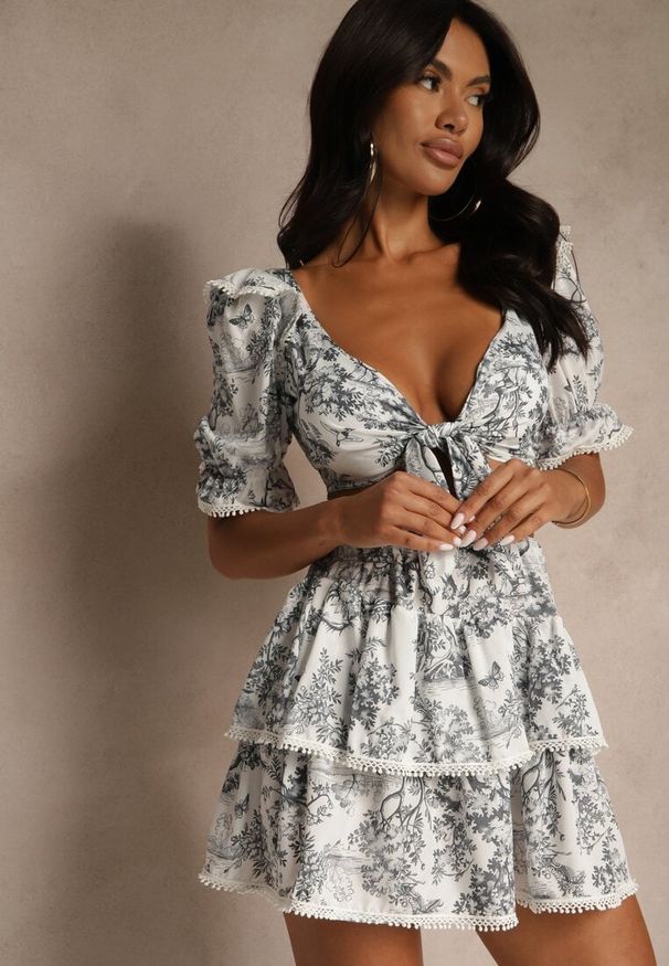 Renee - Biało-Czarny Komplet Bluzka Ozdobiona Wiązaniem i Spódnica z Lamówką Halanisa. Kolor: biały. Wzór: aplikacja