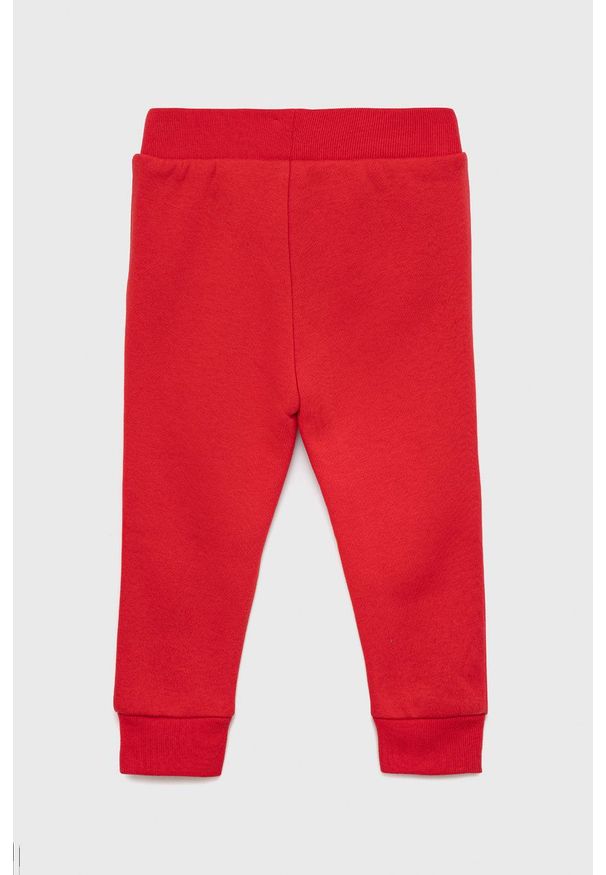 GAP spodnie dresowe dziecięce kolor czerwony gładkie. Okazja: na co dzień. Kolor: czerwony. Materiał: dresówka. Wzór: gładki. Styl: casual