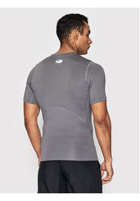 Under Armour Koszulka techniczna HeatGear® 1361518 Szary Slim Fit. Kolor: szary. Materiał: syntetyk