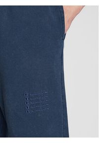 Champion Spodnie dresowe 217896 Granatowy Regular Fit. Kolor: niebieski. Materiał: dresówka, bawełna #4