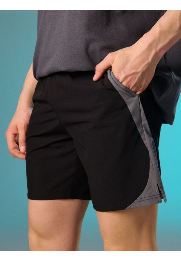 Sinsay - Szorty sportowe - czarny. Kolor: czarny. Styl: sportowy
