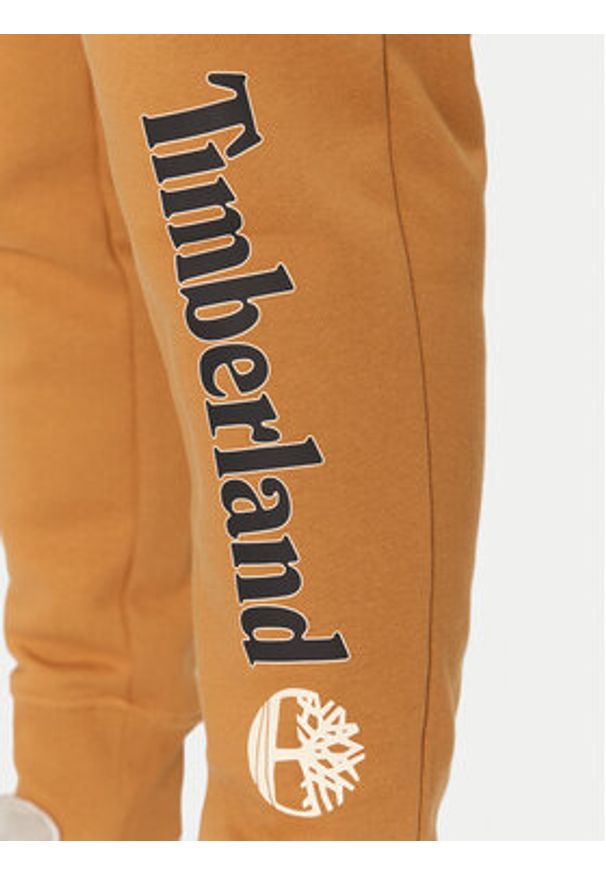 Timberland Spodnie dresowe TB0A5YFB Beżowy Regular Fit. Kolor: beżowy. Materiał: bawełna