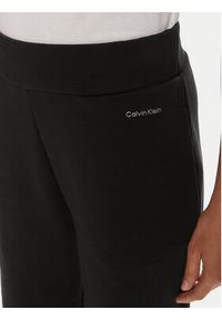 Calvin Klein Spodnie dresowe Nano Logo K20K207214 Czarny Relaxed Fit. Kolor: czarny. Materiał: bawełna #4