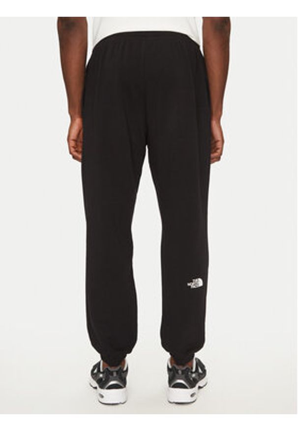 The North Face Spodnie dresowe Simple Dome Light NF0A8C41 Czarny Regular Fit. Kolor: czarny. Materiał: syntetyk, bawełna